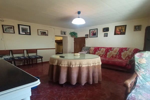 Charming rural home interior in Don Pedro, Jaen, featuring a cozy living room with vintage furniture.