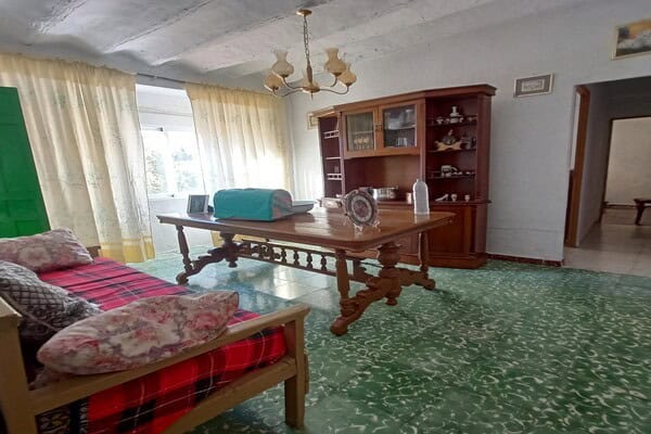 Charming rural home interior in Don Pedro, Jaen, featuring traditional furniture and cozy living spa.