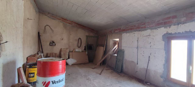 Interior of a rural property under renovation in Jamula, Granada, showing unfinished walls and const.