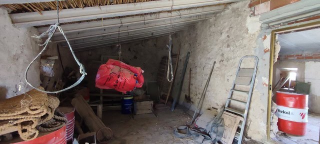 Interior view of rural property in Jamula, Granada with construction tools and materials.