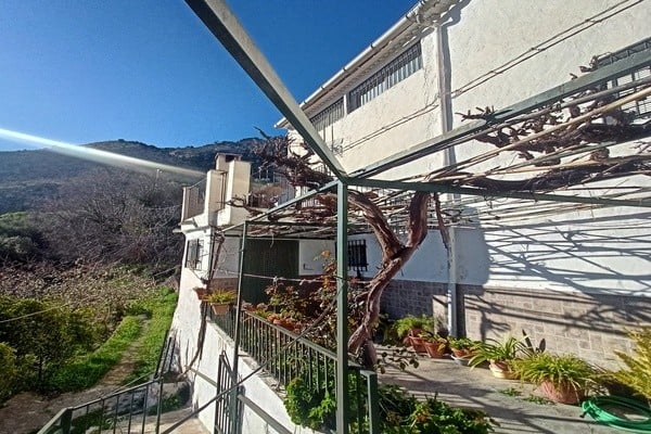 Charming rural property in Don Pedro, Jaen, featuring a terrace with scenic mountain views and lush.