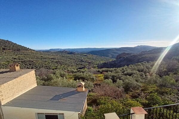Rural property with scenic views in Don Pedro, Jaen, surrounded by lush greenery and rolling hills.
