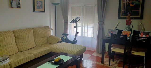 Comfortable living room with natural light in Benamaurel, Granada.