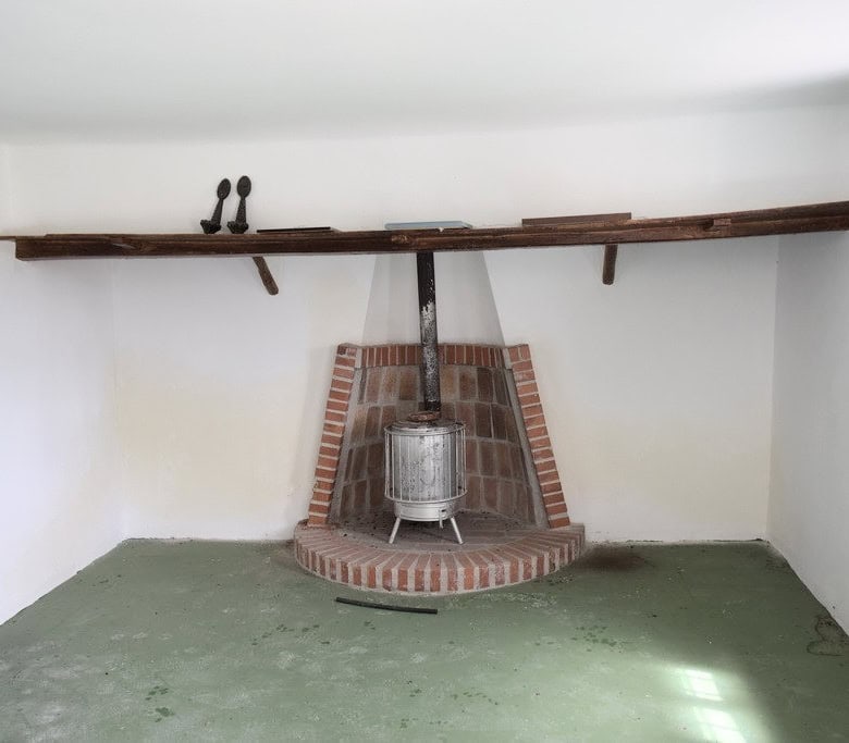 Charming interior with traditional fireplace in a rural Spanish estate. Perfect for country living o.