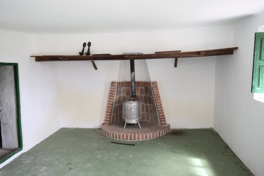 Charming interior with traditional fireplace in a rural Spanish estate. Perfect for country living o.