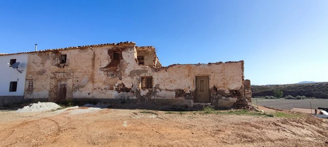 Ancient ruin in Rejano, Granada, showcasing historic stone walls and weathered architecture.