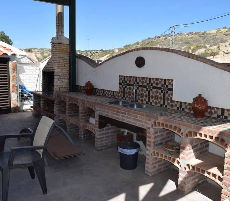 Cave house with outdoor kitchen and traditional tiled accents in Cortes de Baza, Granada. Perfect fo.