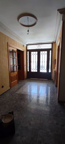 Entrance hall of a town house in Tijola, Almeria, featuring a wooden door with glass panels and a de.
