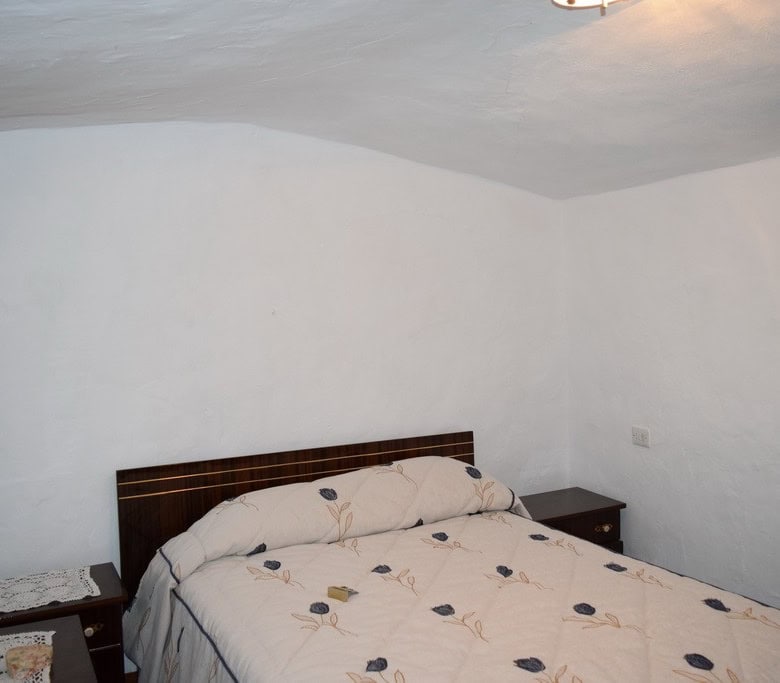 Cave House interior in Bacor, Granada, showcasing traditional rustic decor and cozy ambiance.