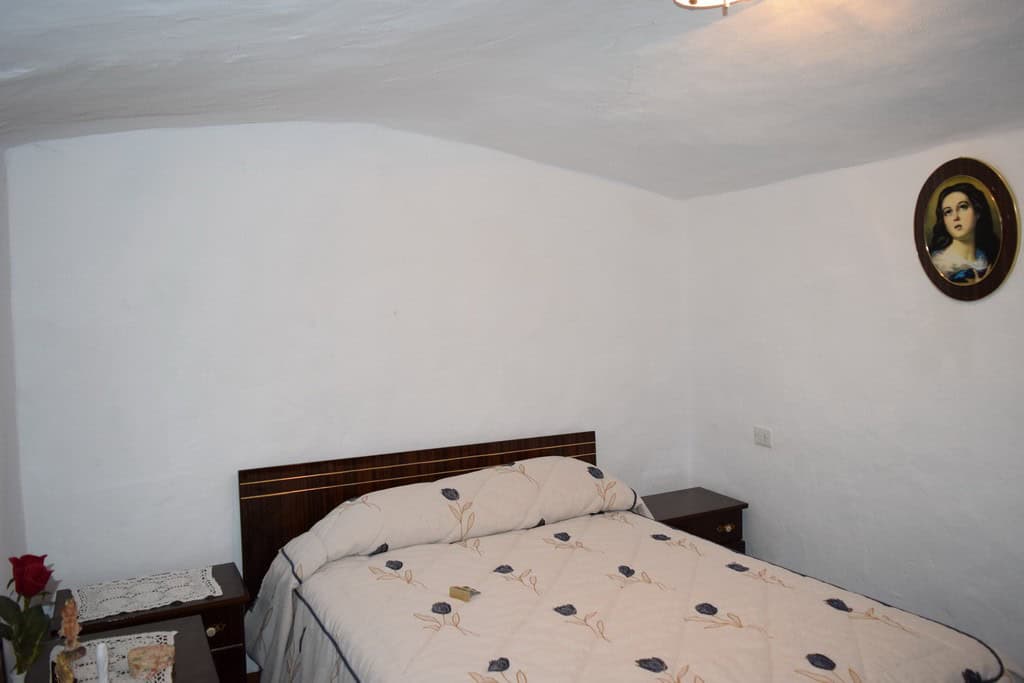 Cave House interior in Bacor, Granada, showcasing traditional rustic decor and cozy ambiance.
