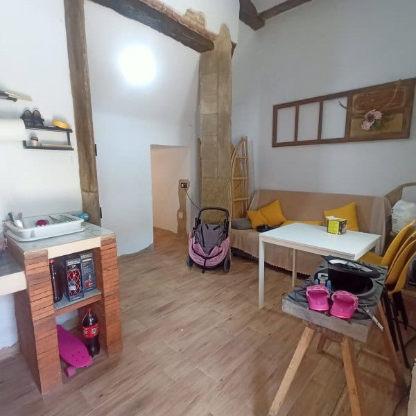 Village Property Interior in Fontanar, Jaen with rustic beams and cozy living space.