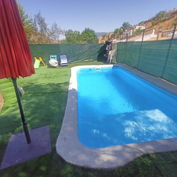 Outdoor swimming pool in a peaceful village setting in Fontanar, Jaen. Perfect for relaxation and en.