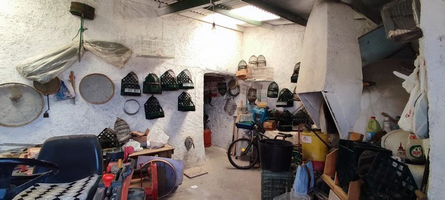 Rustic storage area with tools and household items in Oria, Almeria.