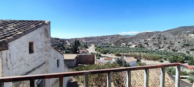 Rural property with scenic views in Oria, Almeria, featuring traditional architecture and surroundin.