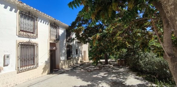 Rural property in Oria, Almeria with traditional architecture and lush trees. Perfect for countrysid.