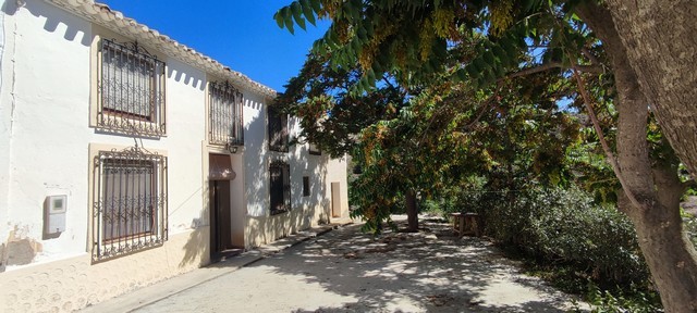 Rural property in Oria, Almeria with traditional architecture and lush trees. Perfect for countrysid.