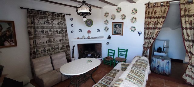 Charming rural property interior in Tijola, Almeria, featuring traditional decor and cozy furnishing.