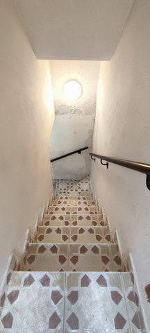 Staircase leading to village property in Bayarque, Almeria with patterned tiles and natural light fr.