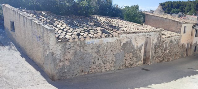 Traditional village property in Bayarque, Almeria with rustic stone walls and tiled roof.
