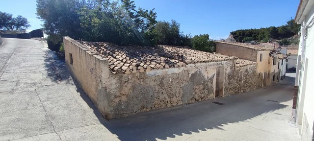 Village property in Bayarque, Almeria with rustic stone walls and traditional architecture.