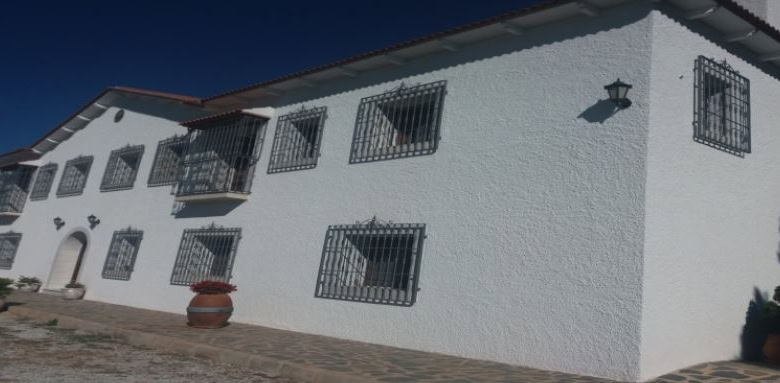 Commercial property for sale in Oria, Almeria, featuring traditional architecture and secure window.