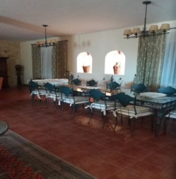 Elegant dining room in Oria, Almeria with traditional decor and spacious layout.