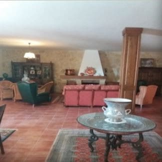 Commercial property in Oria, Almeria featuring a cozy living area with classic furnishings and warm.