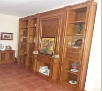 Spacious commercial space in Oria, Almeria featuring wooden shelving and display units.