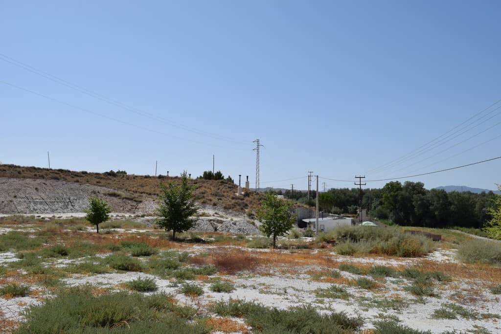 Cave house property for sale in El Margen, Granada, with scenic rural views and natural surroundings.