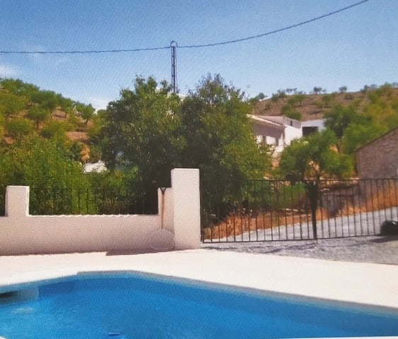 Rural property with a pool in Hijate, Almeria, surrounded by nature and traditional Spanish houses.