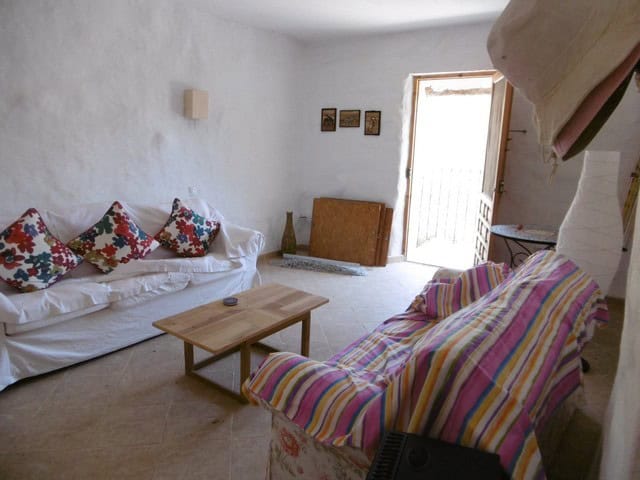 Charming rural home interior with cozy seating and traditional decor in Hijate, Almeria.