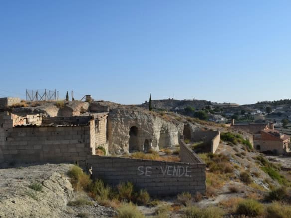 Cave house for sale in Benamaurel, Granada, with historic rock formations and scenic landscape.