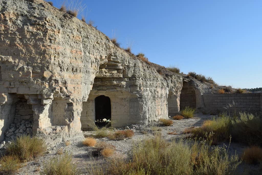 Ancient cave house in Benamaurel, Granada, with natural rock formations and historical architecture.