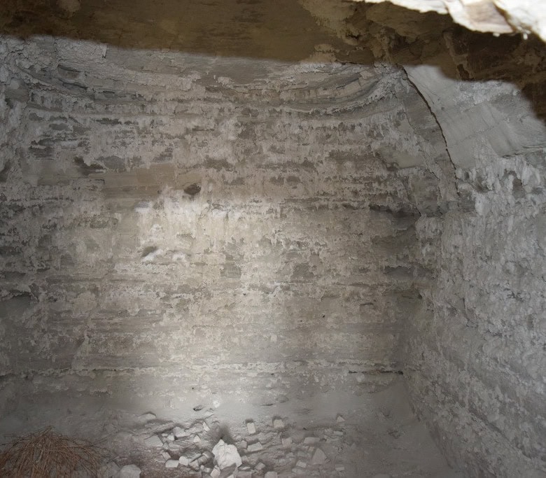 Cave house interior with stone walls in Benamaurel, Granada, showcasing traditional cave dwelling ar.