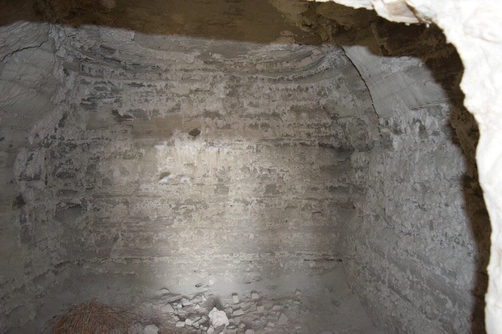 Cave house interior with stone walls in Benamaurel, Granada, showcasing traditional cave dwelling ar.