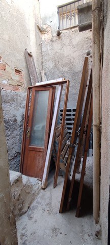 Wooden door and window frames in a rustic, unfinished property in Tijola, Almeria.