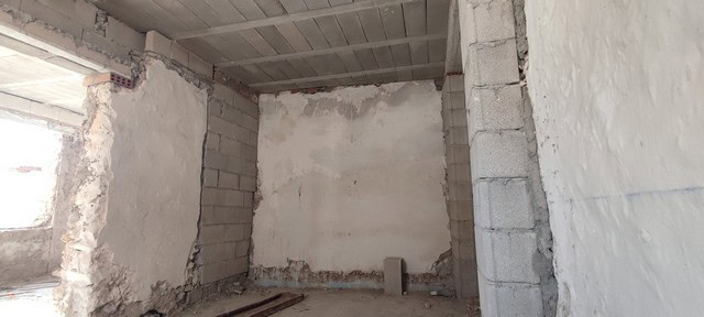 Interior view of a partially built town house in Tijola, Almeria, showing unfinished walls and struc.