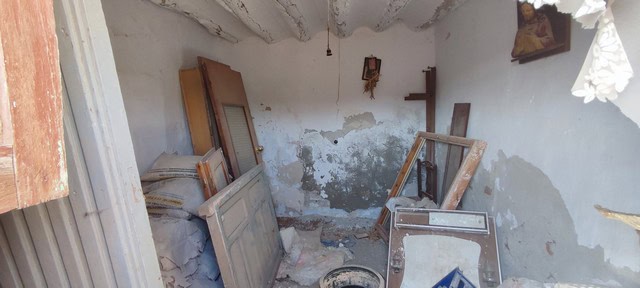 Old rural property interior in Olula del Rio, Almeria showing neglected walls and abandoned furnitur.