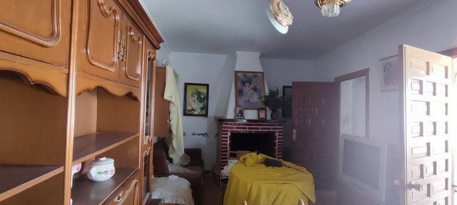 Town House interior with traditional furnishings in Tijola, Almeria, featuring a fireplace and rusti.