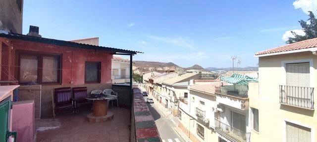 Town House in Tijola, Almeria offering scenic mountain views and a spacious terrace. Ideal for a pea.
