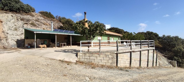 Rural property in Sierro, Almeria with scenic mountain views and solar panels. Ideal for countryside.