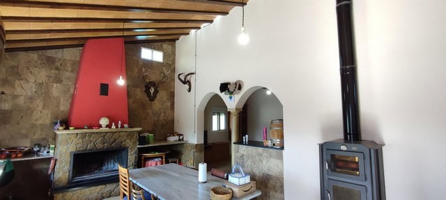 Charming rural home interior with fireplace and cozy living space in Sierro, Almeria.