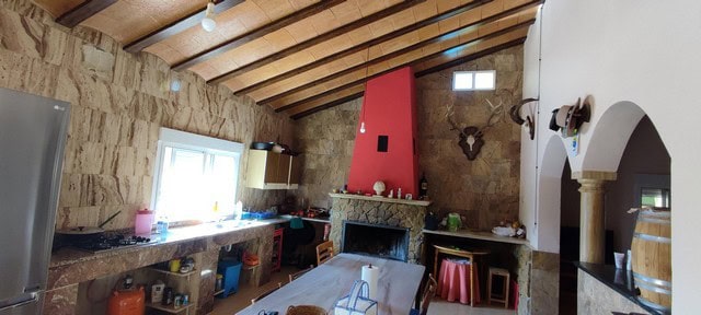 Beautiful interior of a rural property in Sierro, Almeria, showcasing traditional stone walls and co.