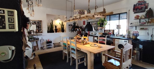 Charming interior of a village property in Las Vertientes, Granada, featuring a rustic dining area w.