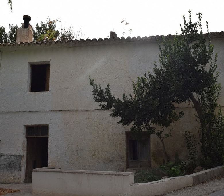 Village property for sale in Cortes de Baza, Granada, with traditional architecture and surrounding.