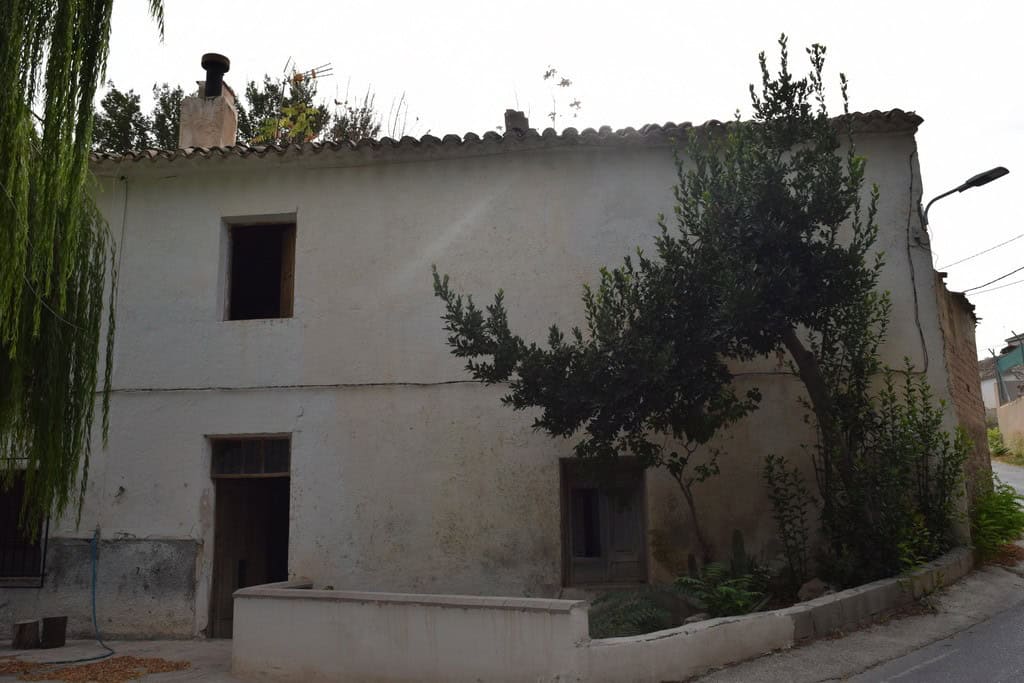Village property for sale in Cortes de Baza, Granada, with traditional architecture and surrounding.
