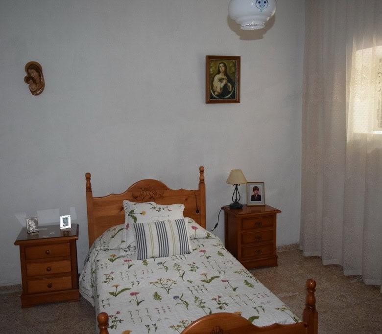 Cozy bedroom in a village property located in Cortes de Baza, Granada, featuring traditional decor a.