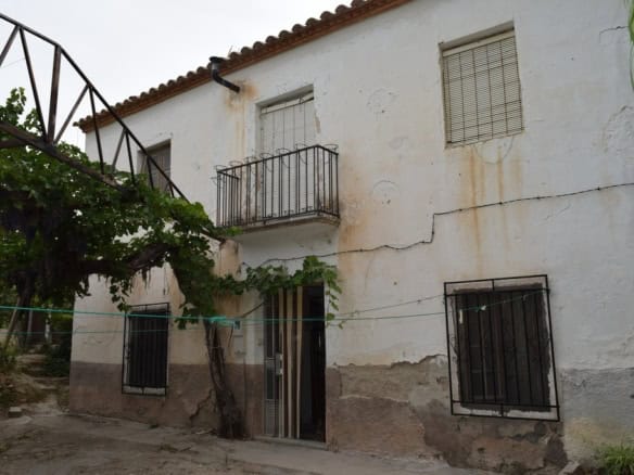 Charming village house in Cortes de Baza, Granada, with traditional features and outdoor space.