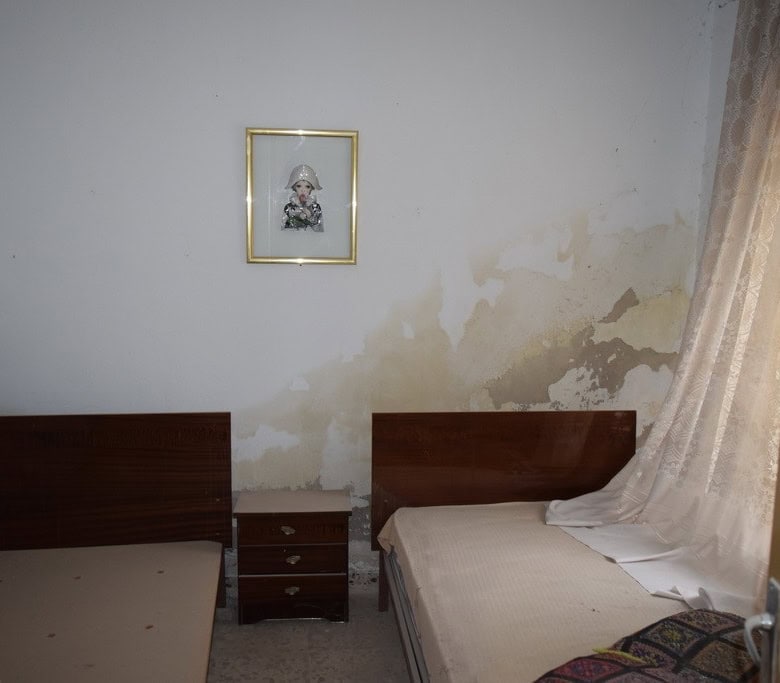 Bedroom in village property located in Cortes de Baza, Granada, with two single beds and simple deco.