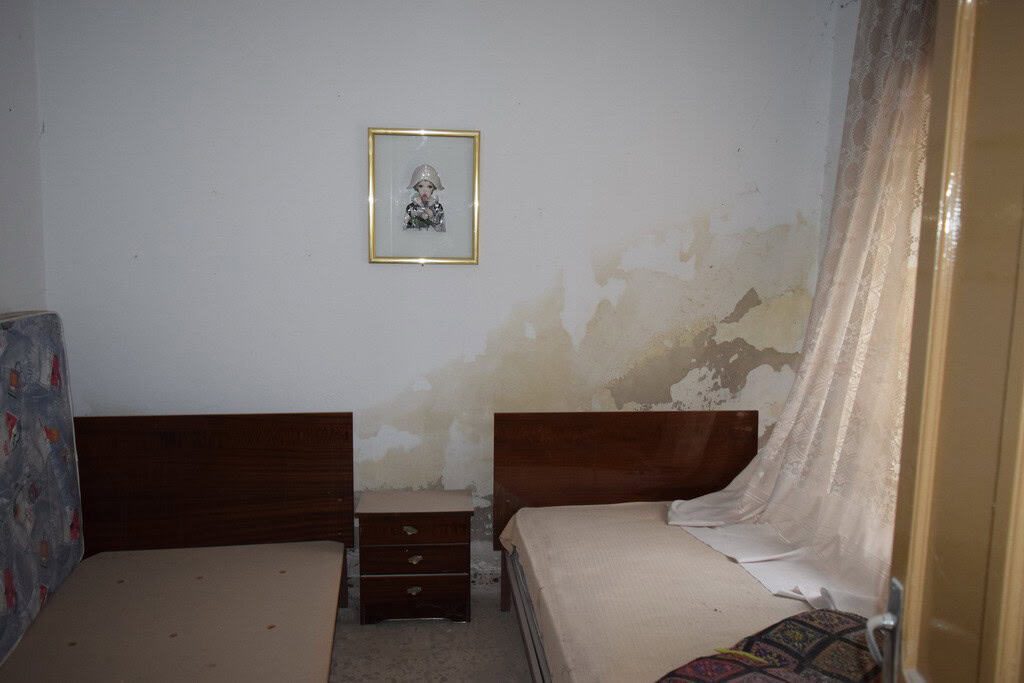 Bedroom in village property located in Cortes de Baza, Granada, with two single beds and simple deco.